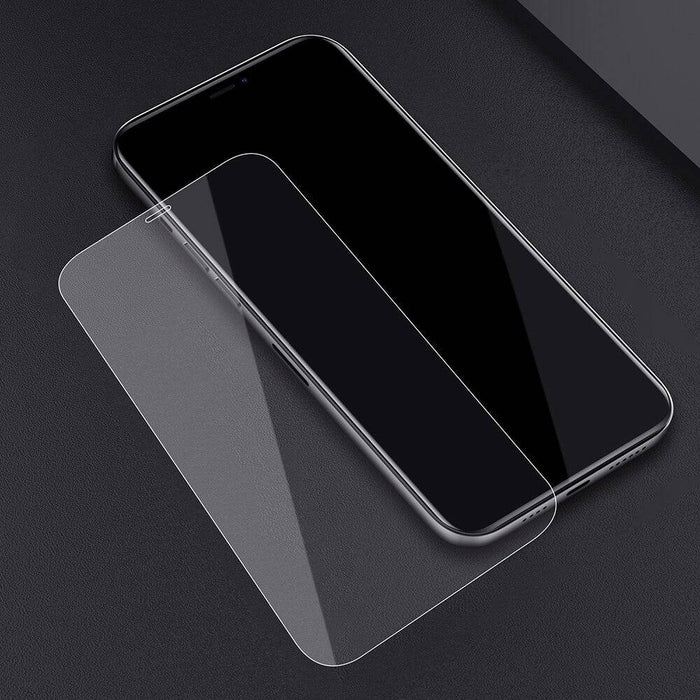 Detailed view of Japan Clear AB Glue adhesive layer on Kinglas iPhone 12 mini screen protector showing 0.1mm thickness and bubble-free application properties